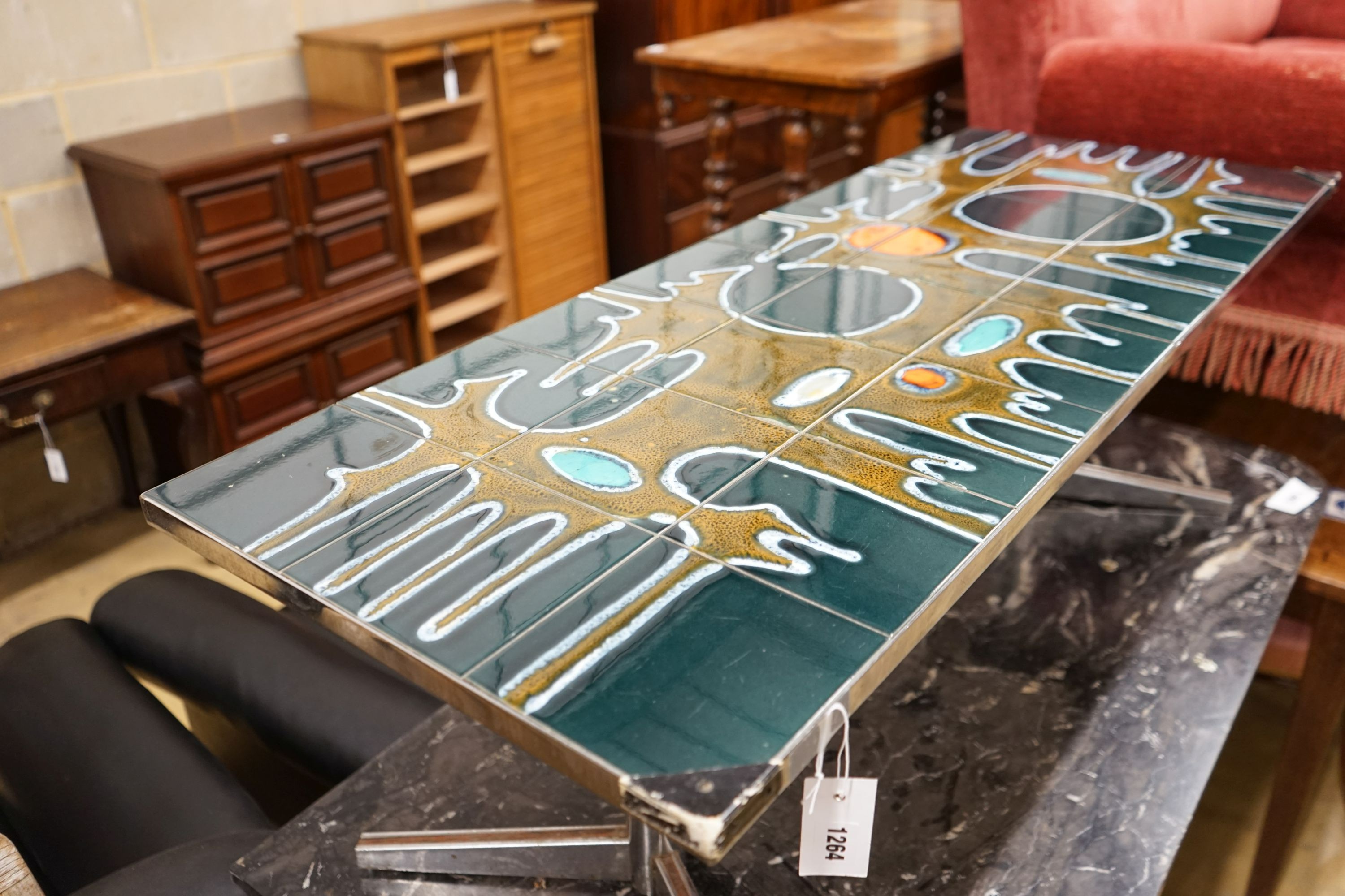 A mid century design tile topped rectangular chrome coffee table, length 121cm, depth 46cm, height 41cm